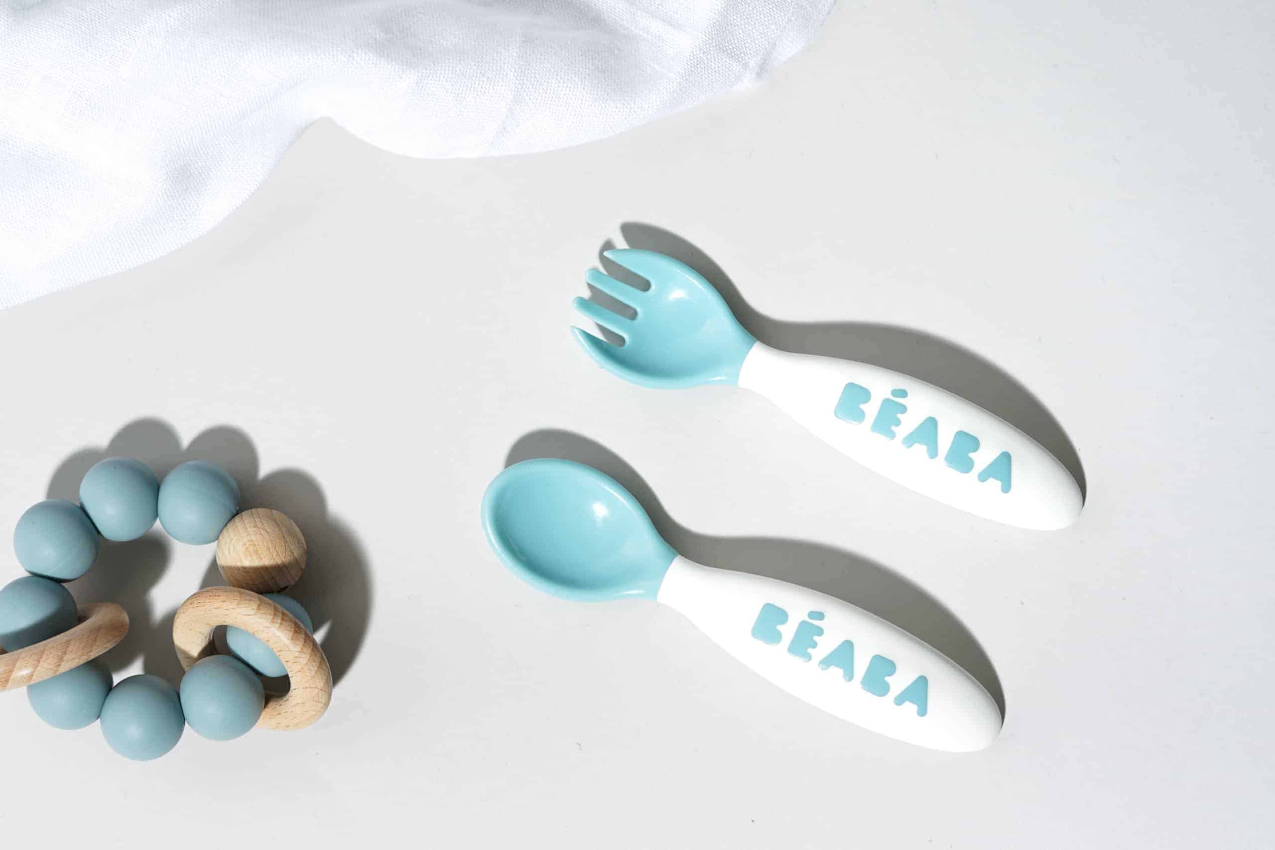 Beaba Toddler Cutlery next to rattle