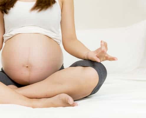 Pregnant mom meditating