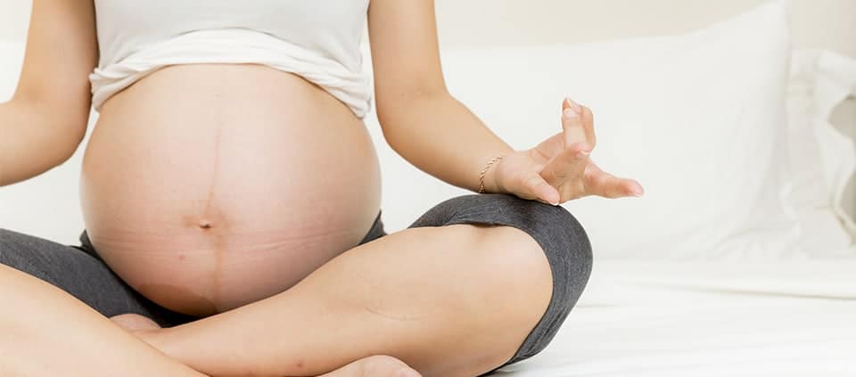 Pregnant mom meditating