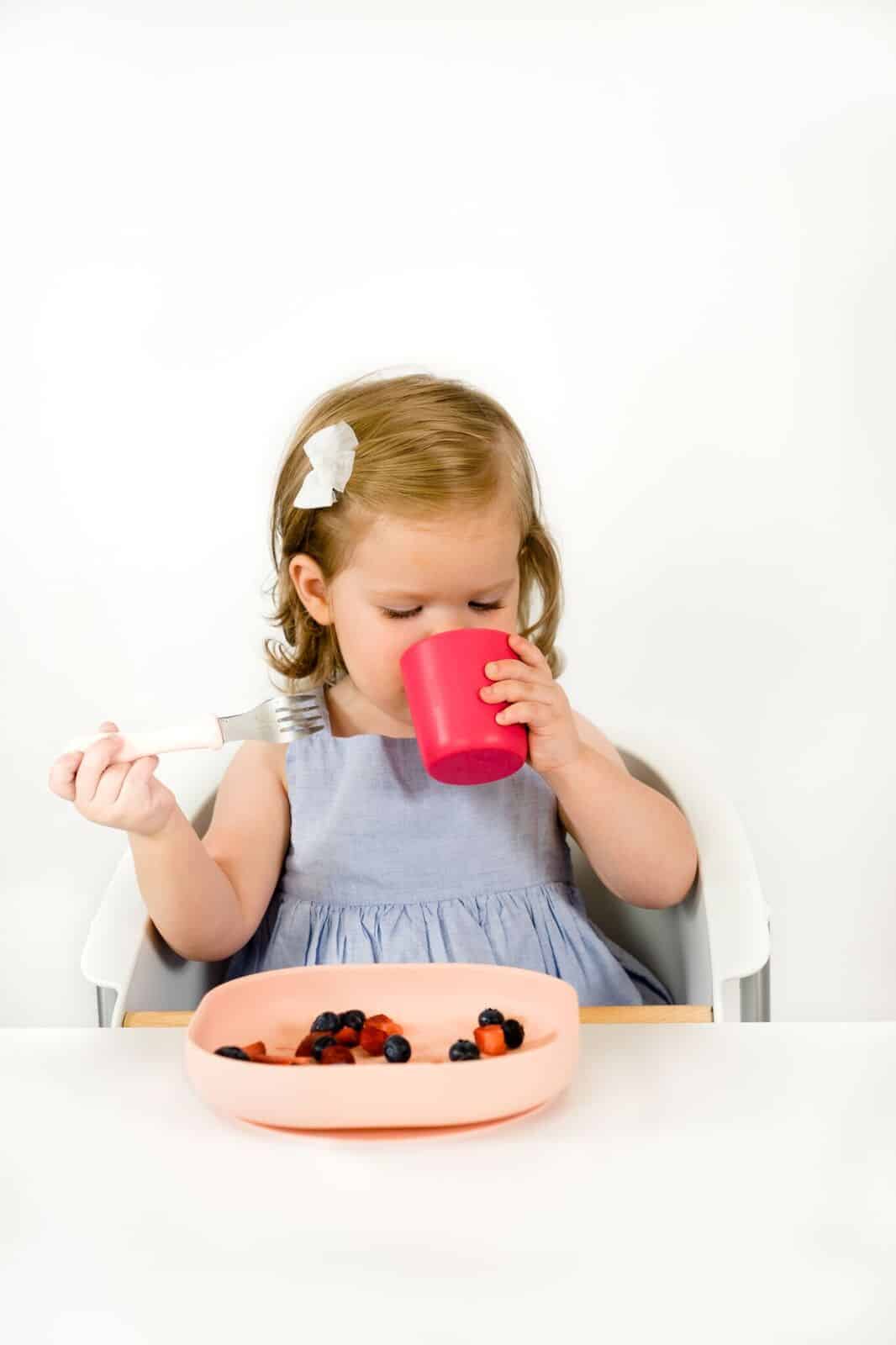 Toddler Drinking From Beaba Silicone Cup Berry