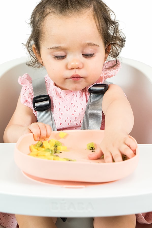 Toddler eating with silicone suction plate rose
