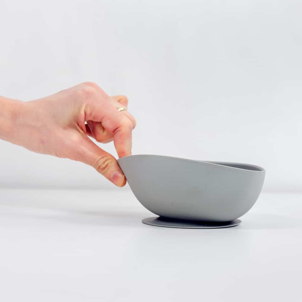 Hand tugging on silicon suction bowl cloud
