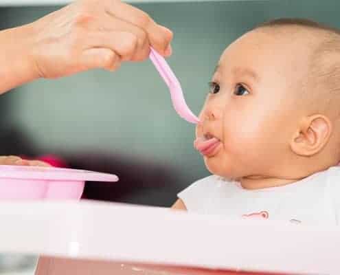 Baby Being Fed with Spoon