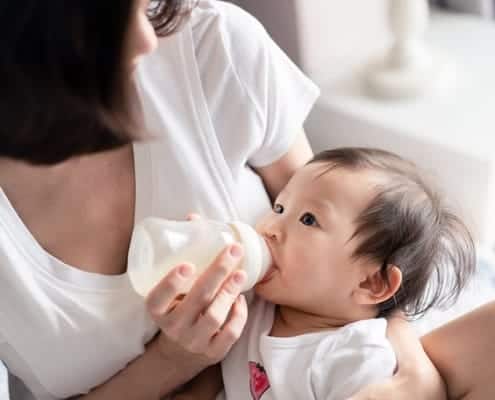 Mom Feeding Baby Milk Bottle
