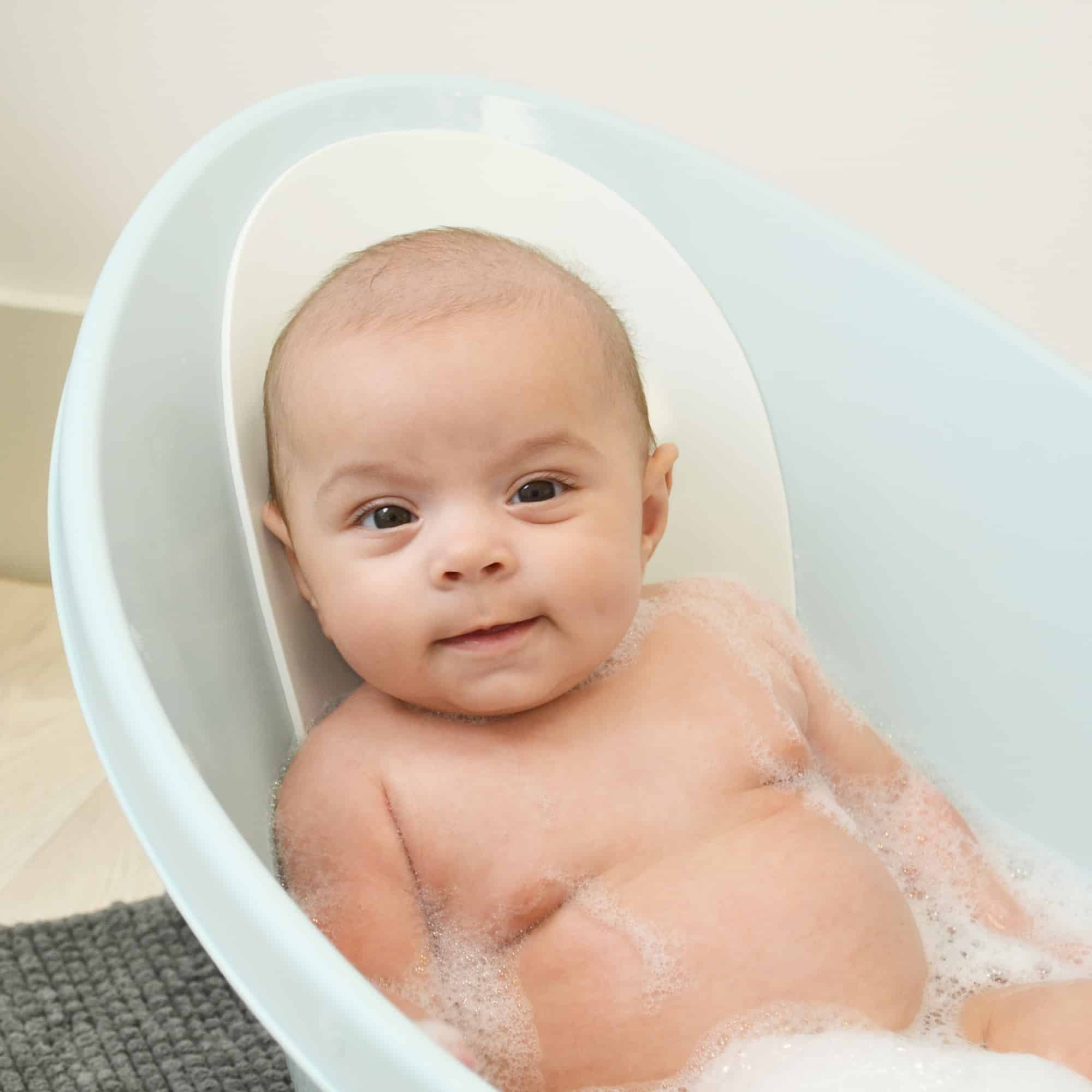 baby sitting in Beaba by Shnuggle Baby bath in aqua