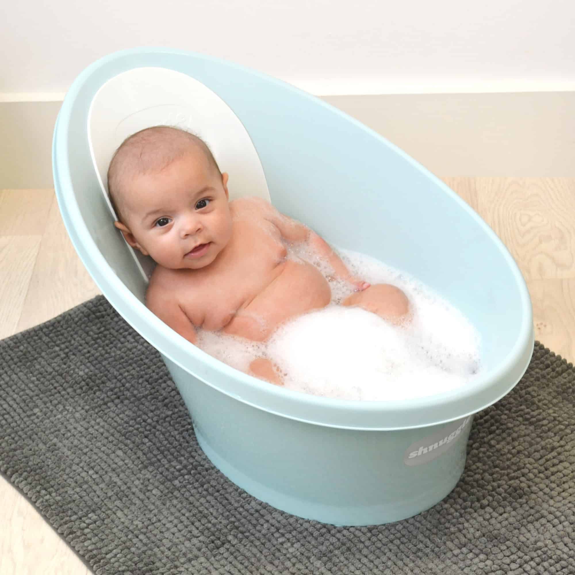 Baby sitting in Beaba by Shnuggle Baby bath