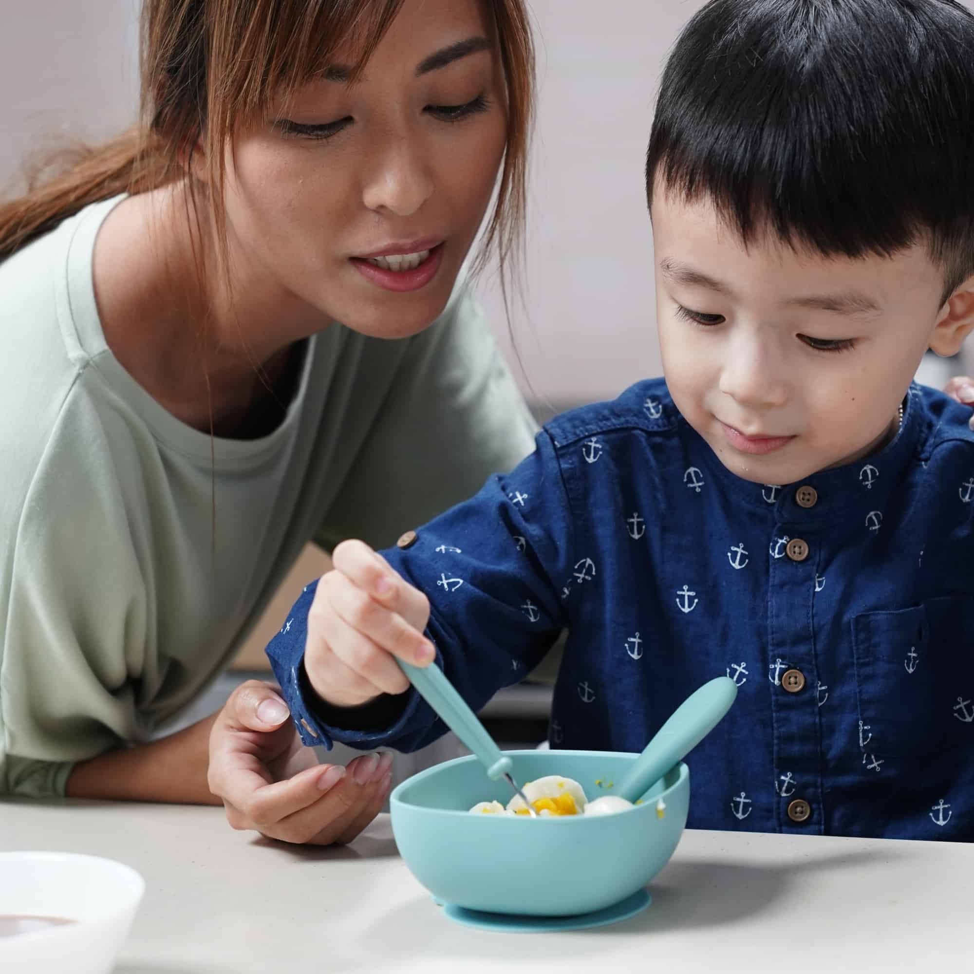 Boy Eating With Beaba Children's First Flatware Set