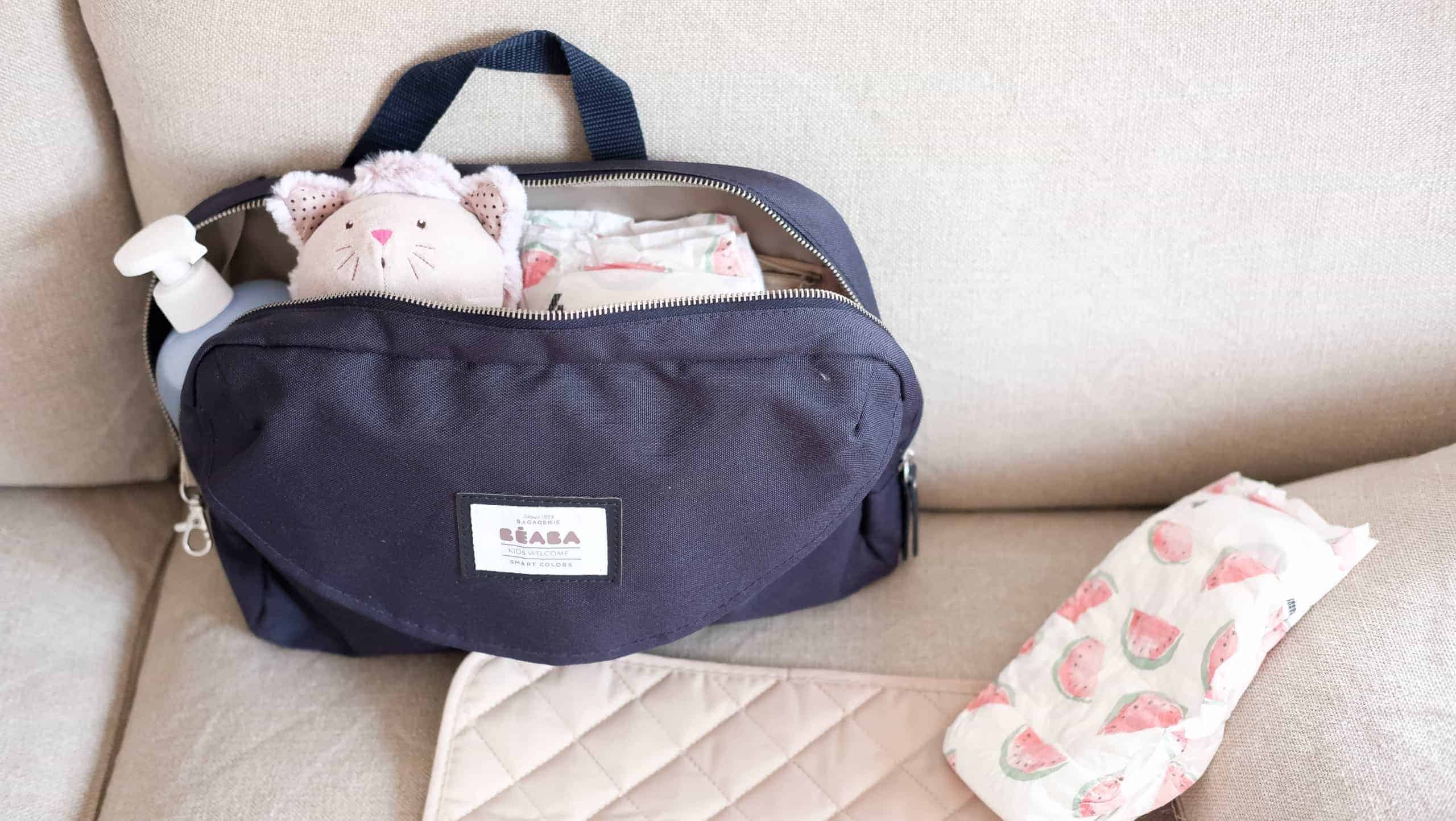 Beaba must have modern diaper bag holding toys and diapers