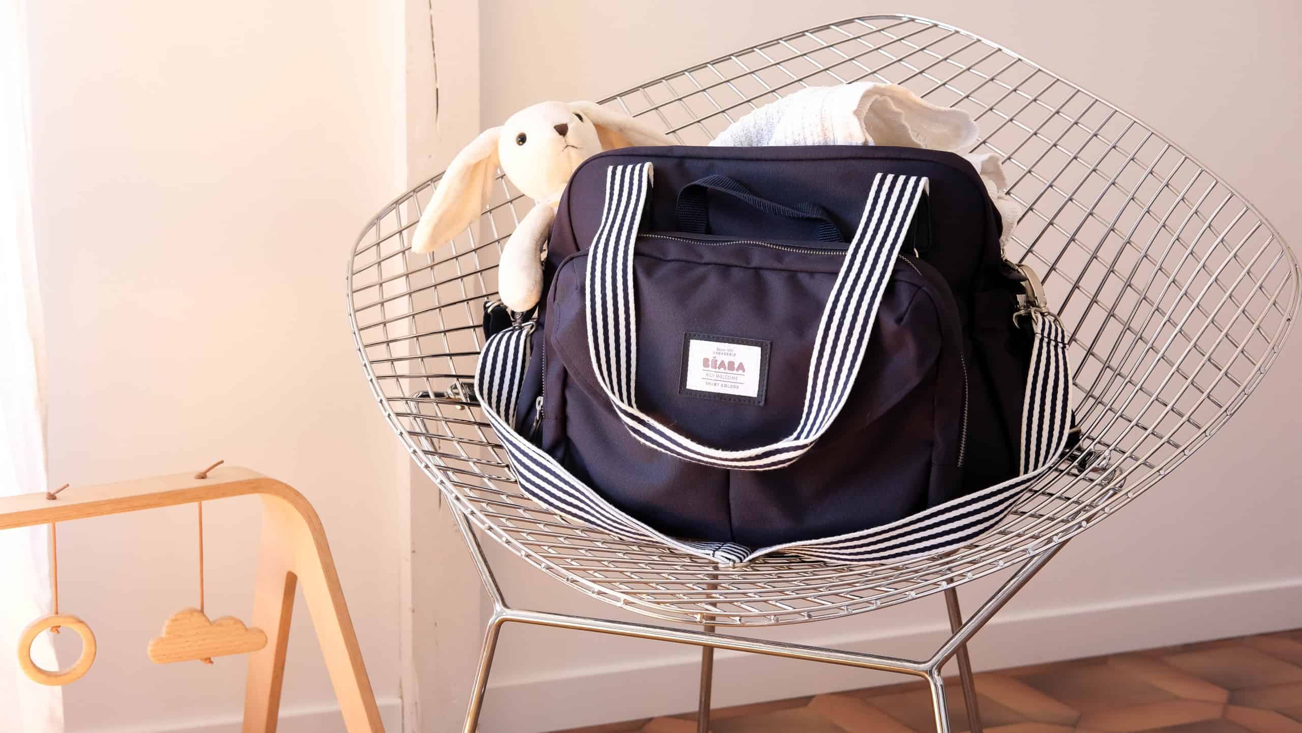 Beaba must have modern diaper bag on chair with rabbit inside