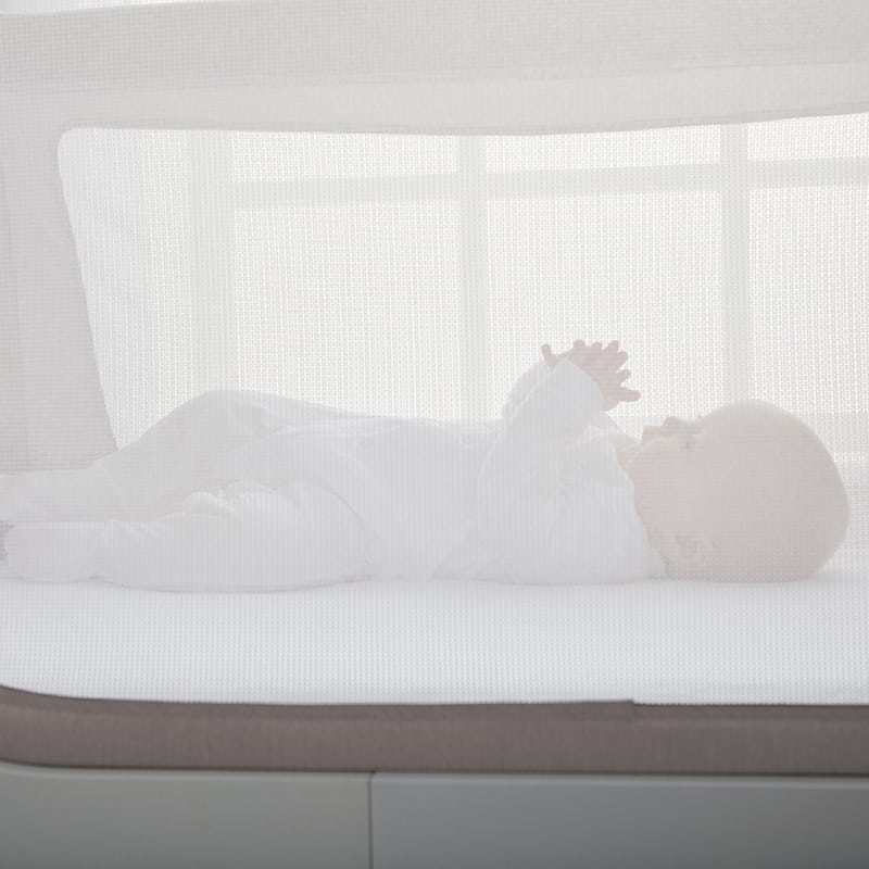 Baby in Beaba by Shnuggle Air Cot