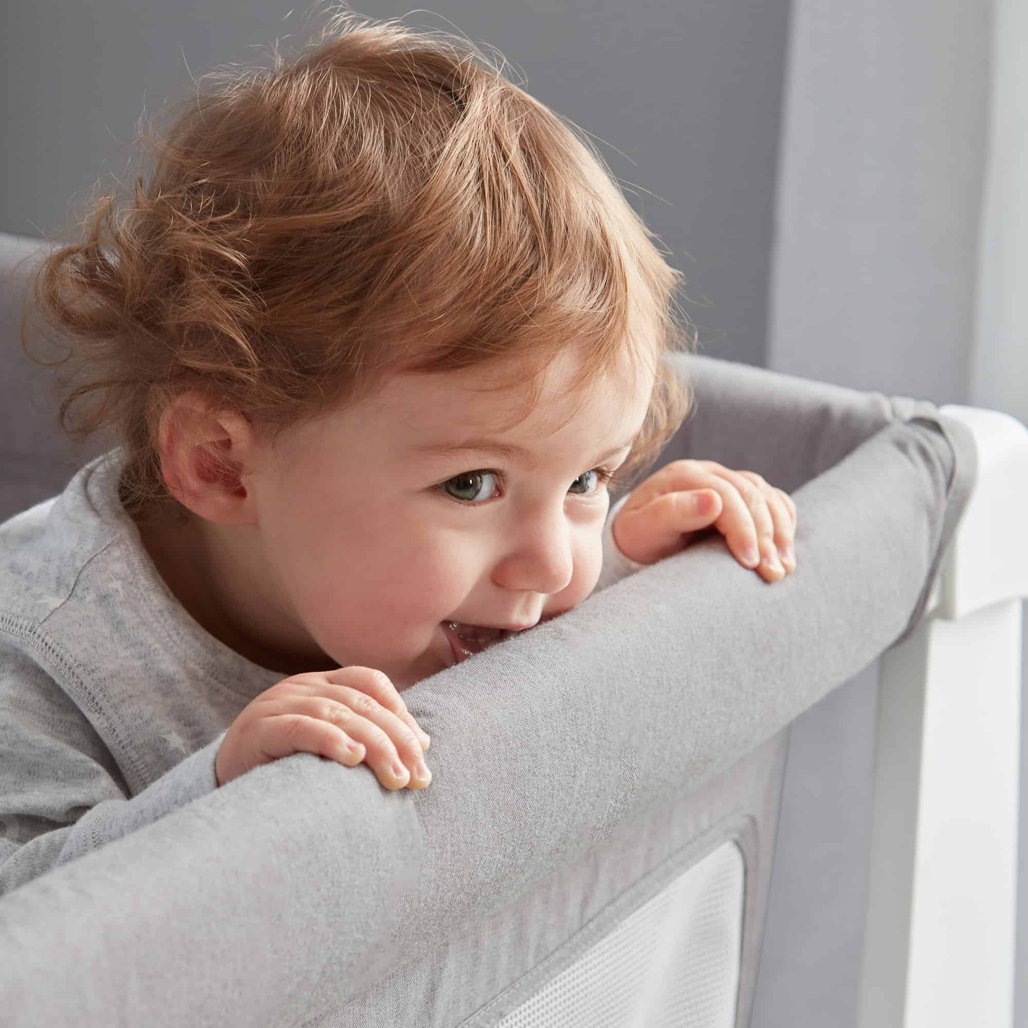 Toddler biting on crib sides