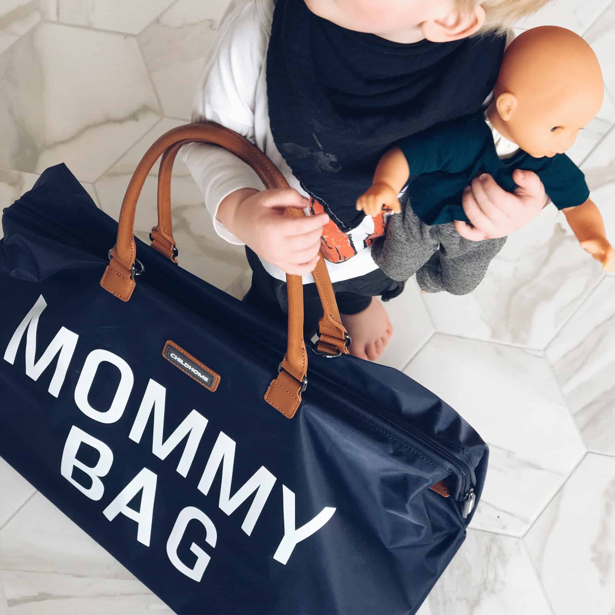 Baby holding Childhome Mommy Bag Navy