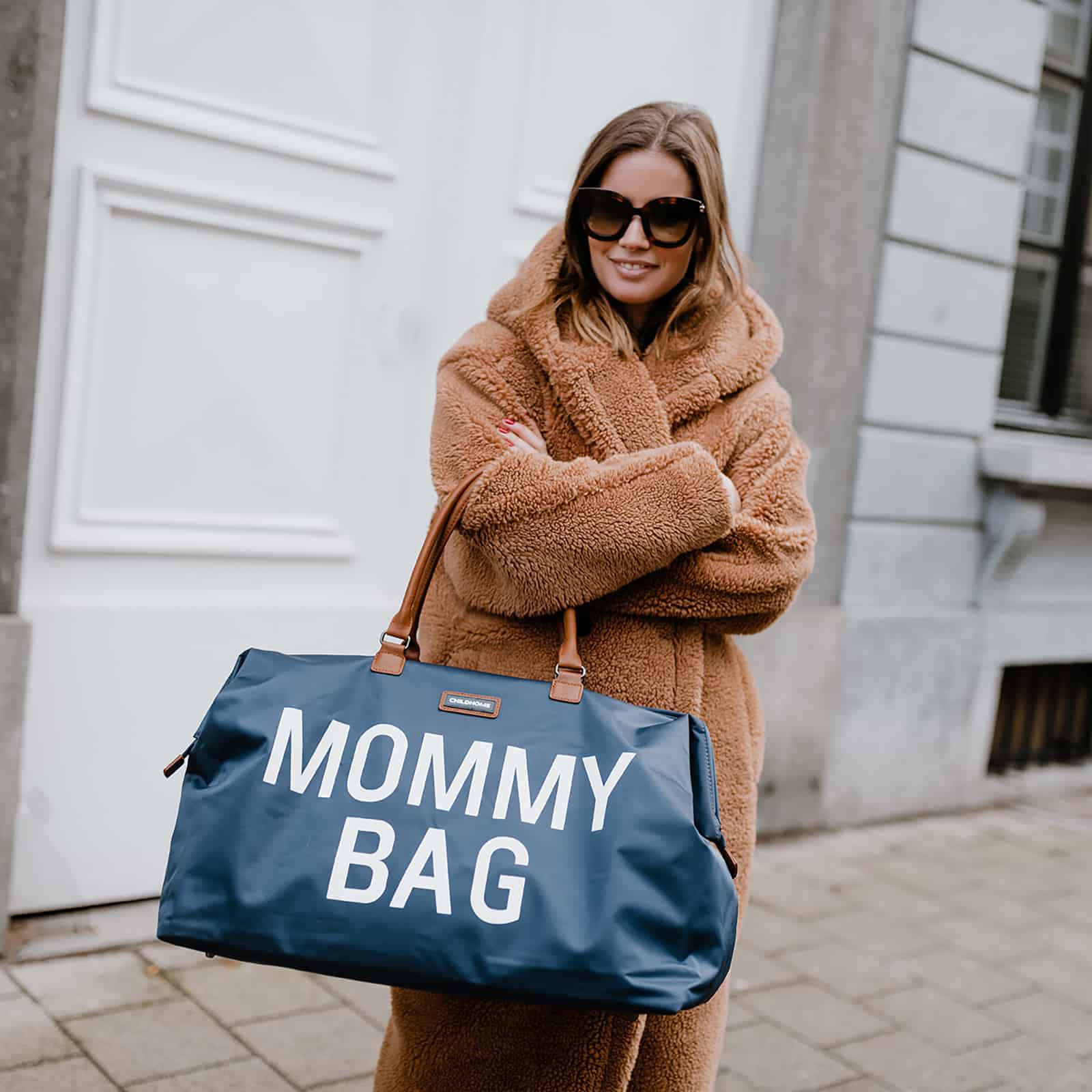 Mom holdingChildhome Mommy Bag Navy