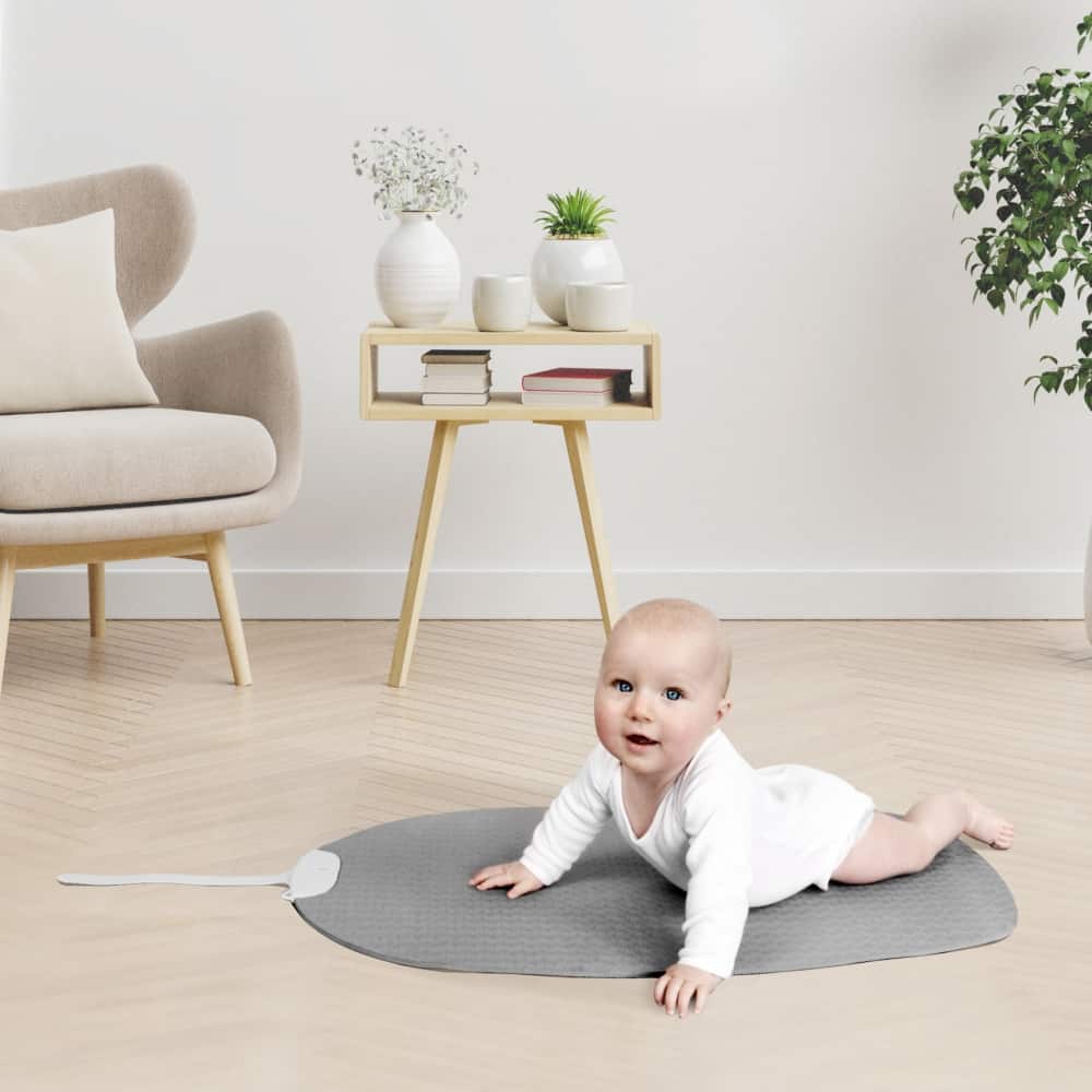 baby on grey yoga play mat