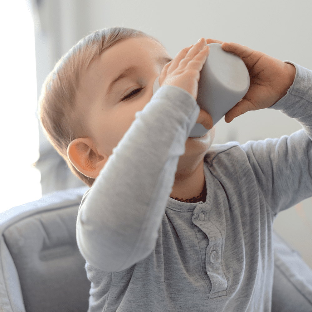 Baby drinking from cup