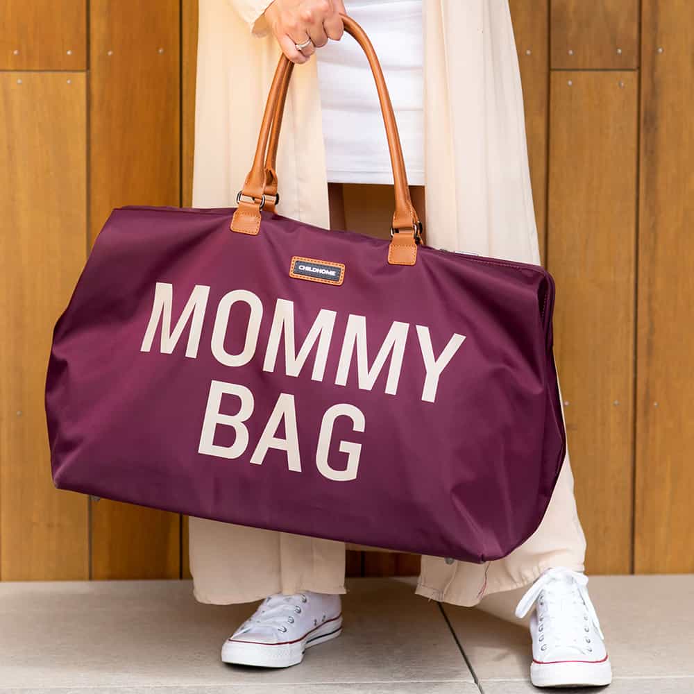 Mom holding Childhome Mommy Bag Aubergine Front
